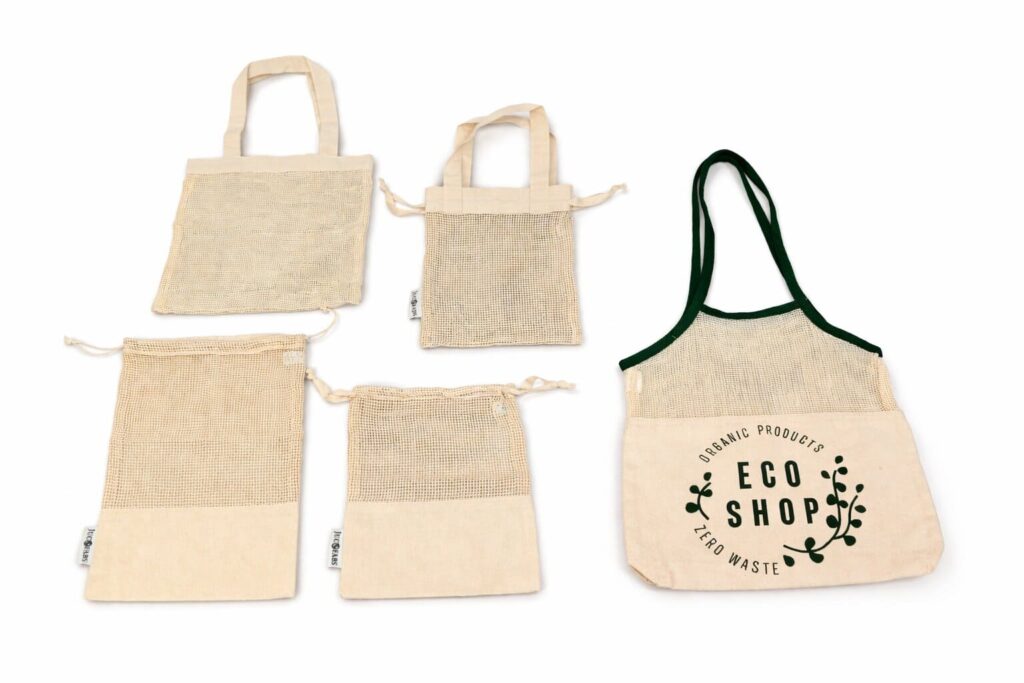 Wholesale eco-friendly reusable mesh bags with organic cotton and jute construction for US grocery retailers, produce stores, and farmers markets by Indian Crafts Supply